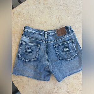 Blue denim shorts with frayed hem
